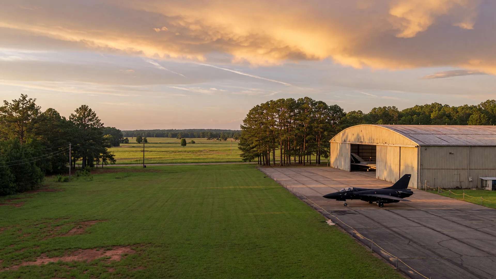 Aviation museum hangar and vintage aircraft on an open apron along the I-75 corridor in Houston County, Georgia