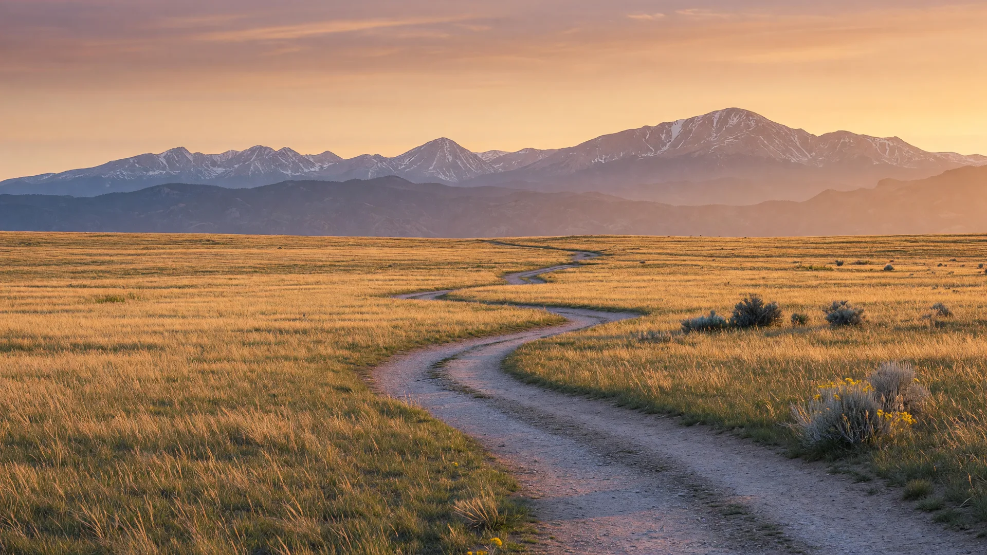 Golden hour walk along open-space trails with the Front Range on the horizon