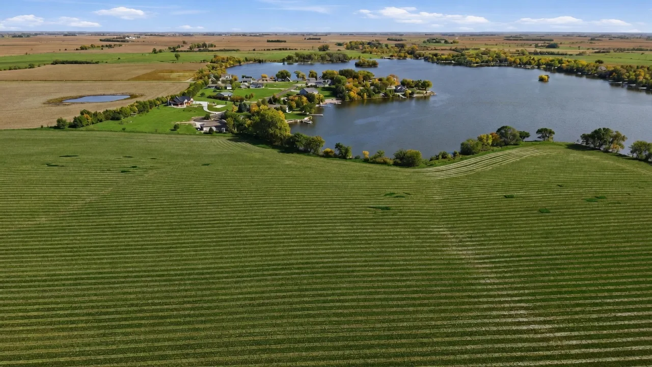 Aerial view of the mowed 2.50-acre building lot on the west shore of Swan Lake