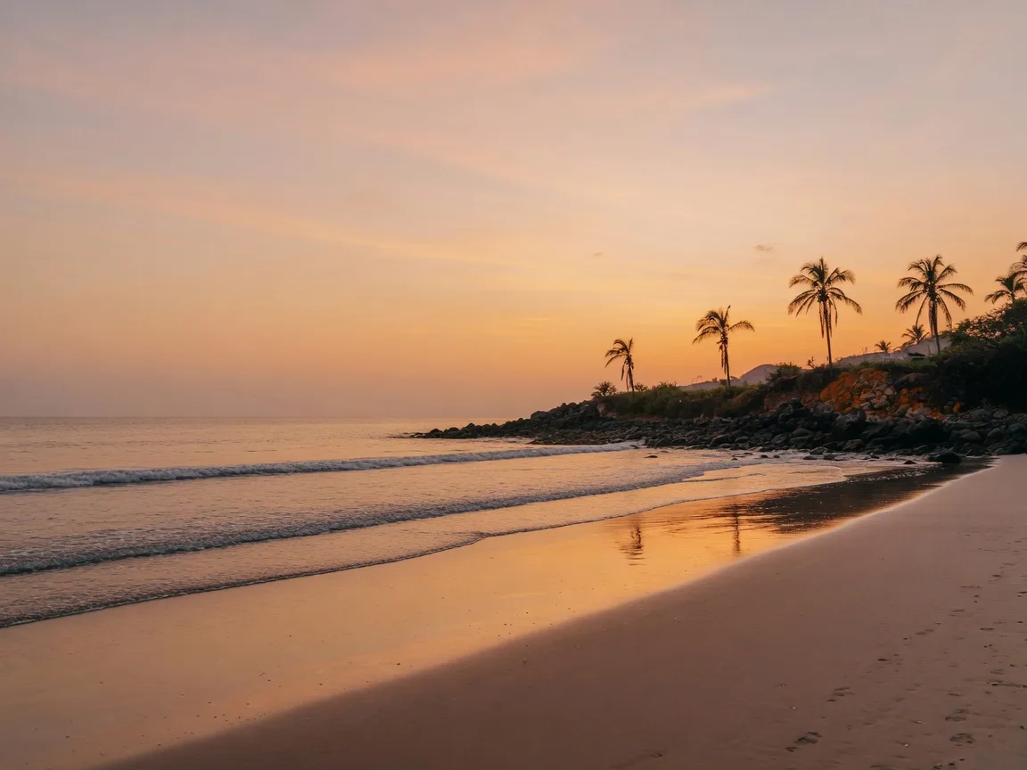 Quiet surf coastline in Riviera Nayarit at dusk, golden waves rolling onto the sand