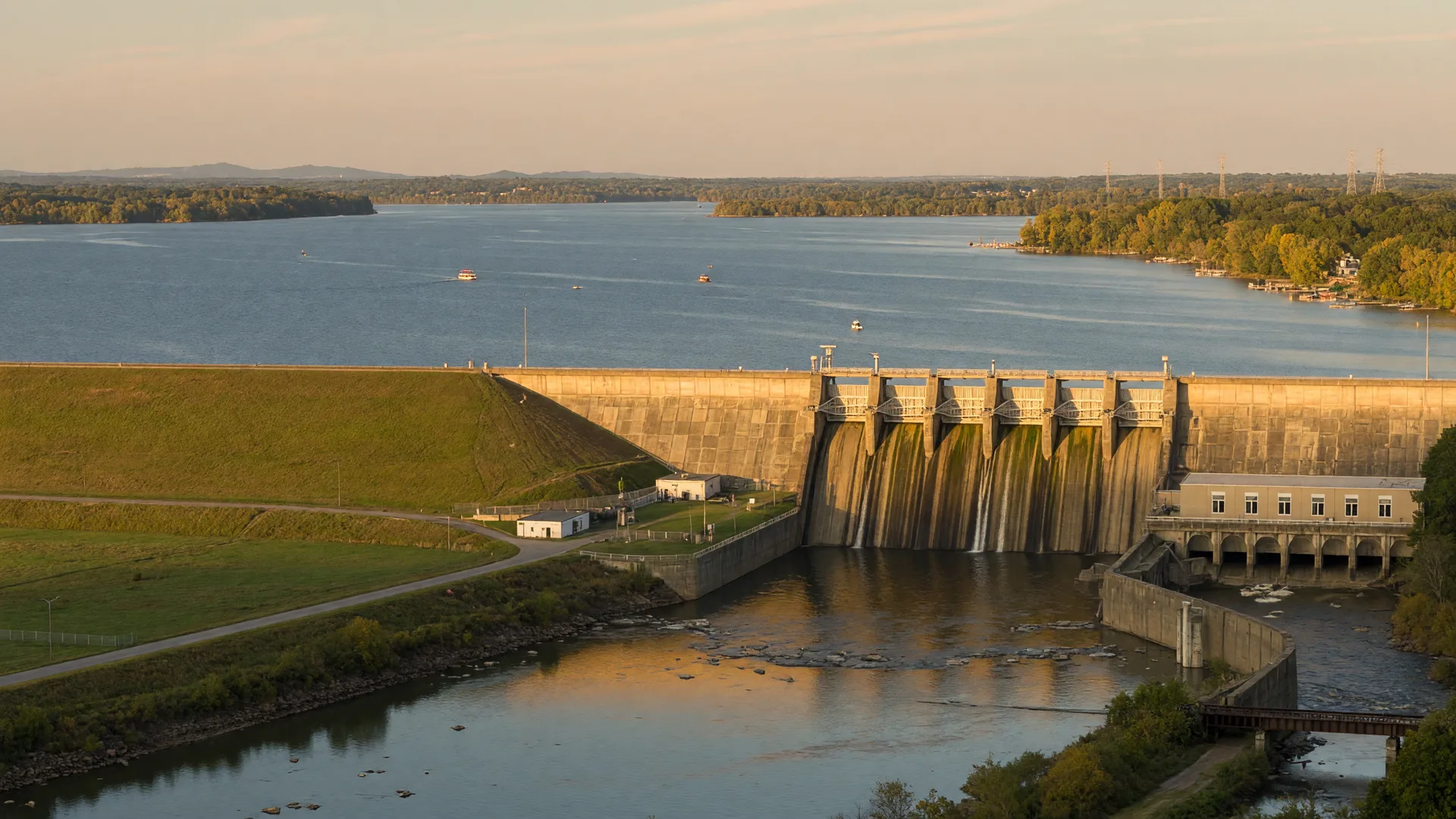 Hartwell Dam holding the wide blue reservoir above the released Savannah River on a hazy late-September afternoon