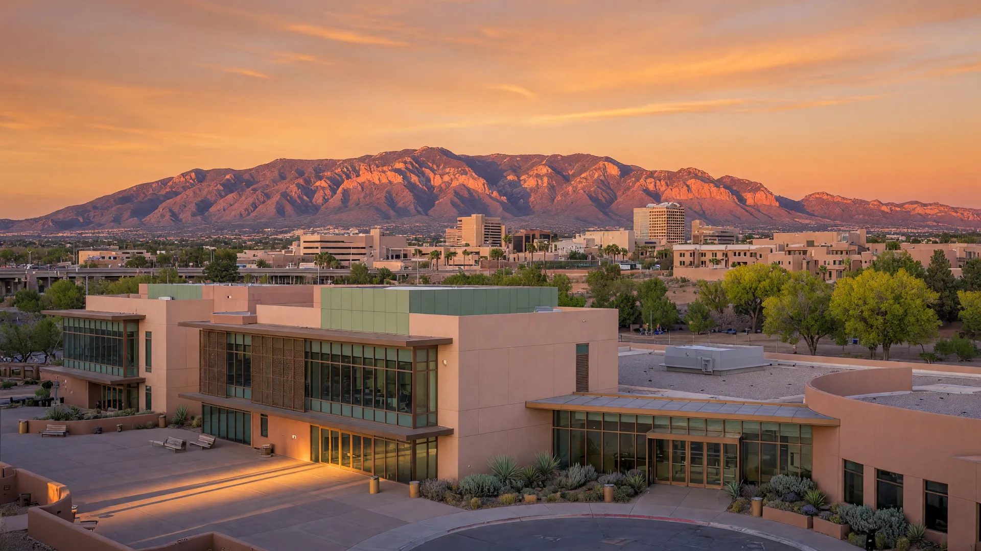 Albuquerque skyline at golden hour with Sandia Mountains and medical center
