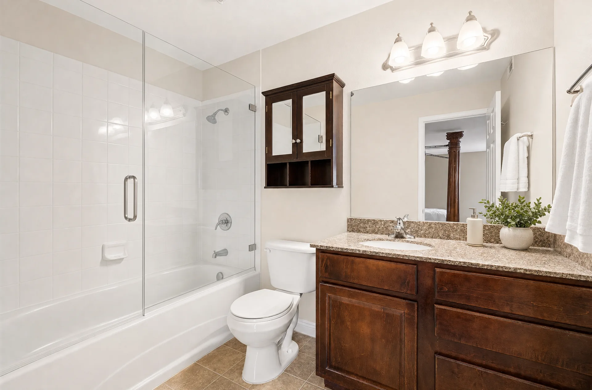 Virtually staged bathroom with a dark wood vanity