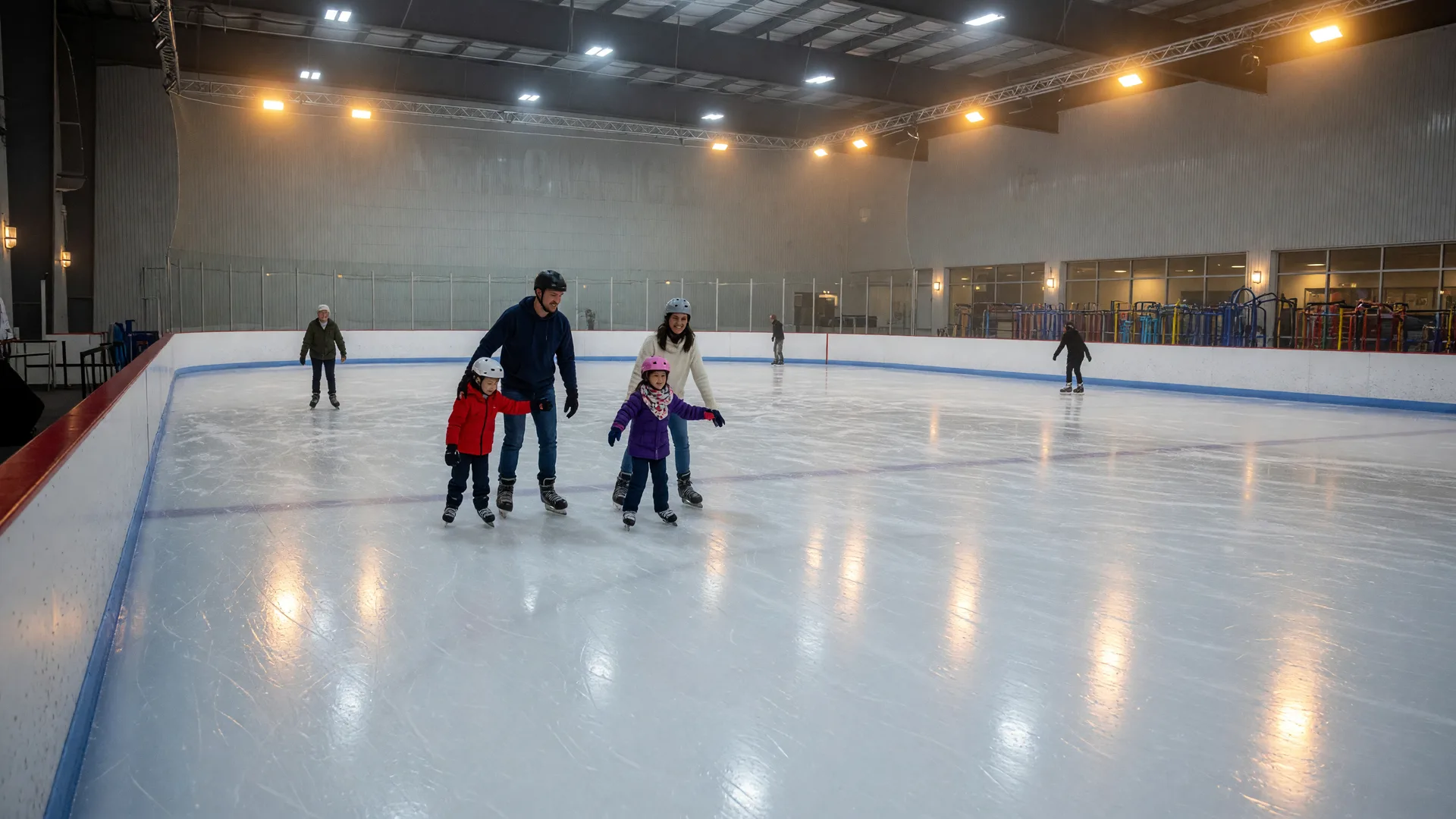 Families ice skating on a bright indoor rink with glossy ice and warm arena lights in Valencia