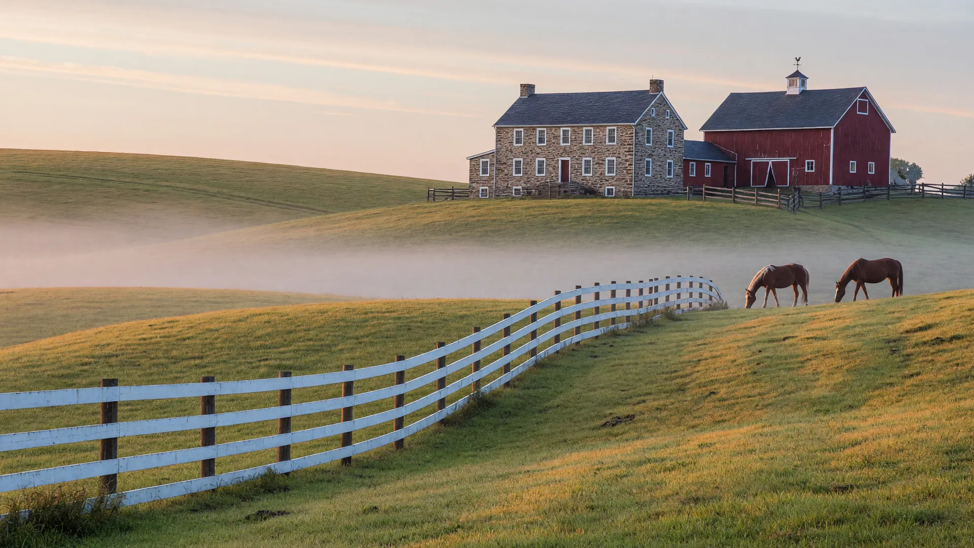 Rolling equestrian countryside with horse pasture fences in Lower Gwynedd