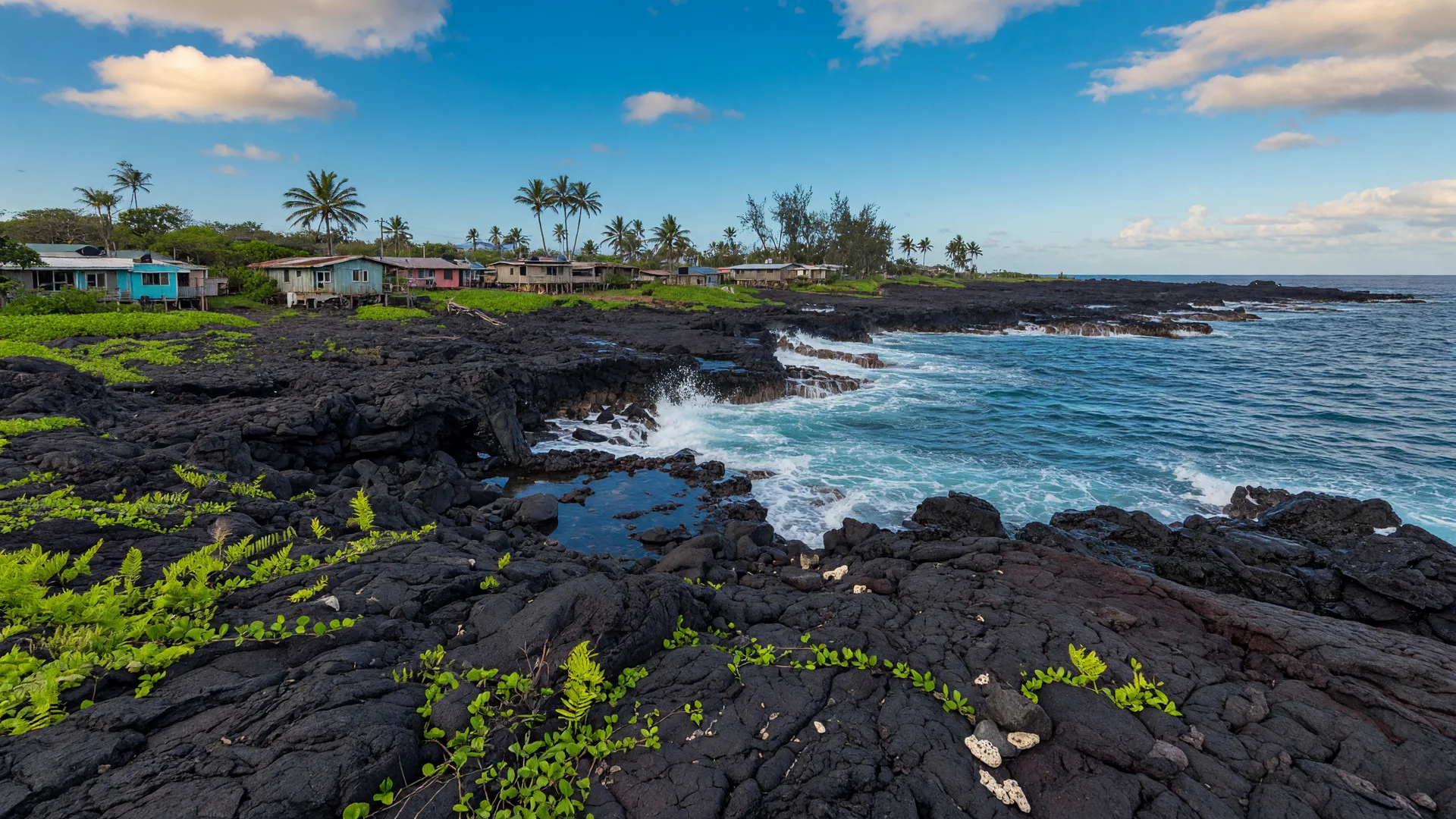 Black lava fields meeting the Pacific Ocean on the Puna coastline of Hawaiʻi Island