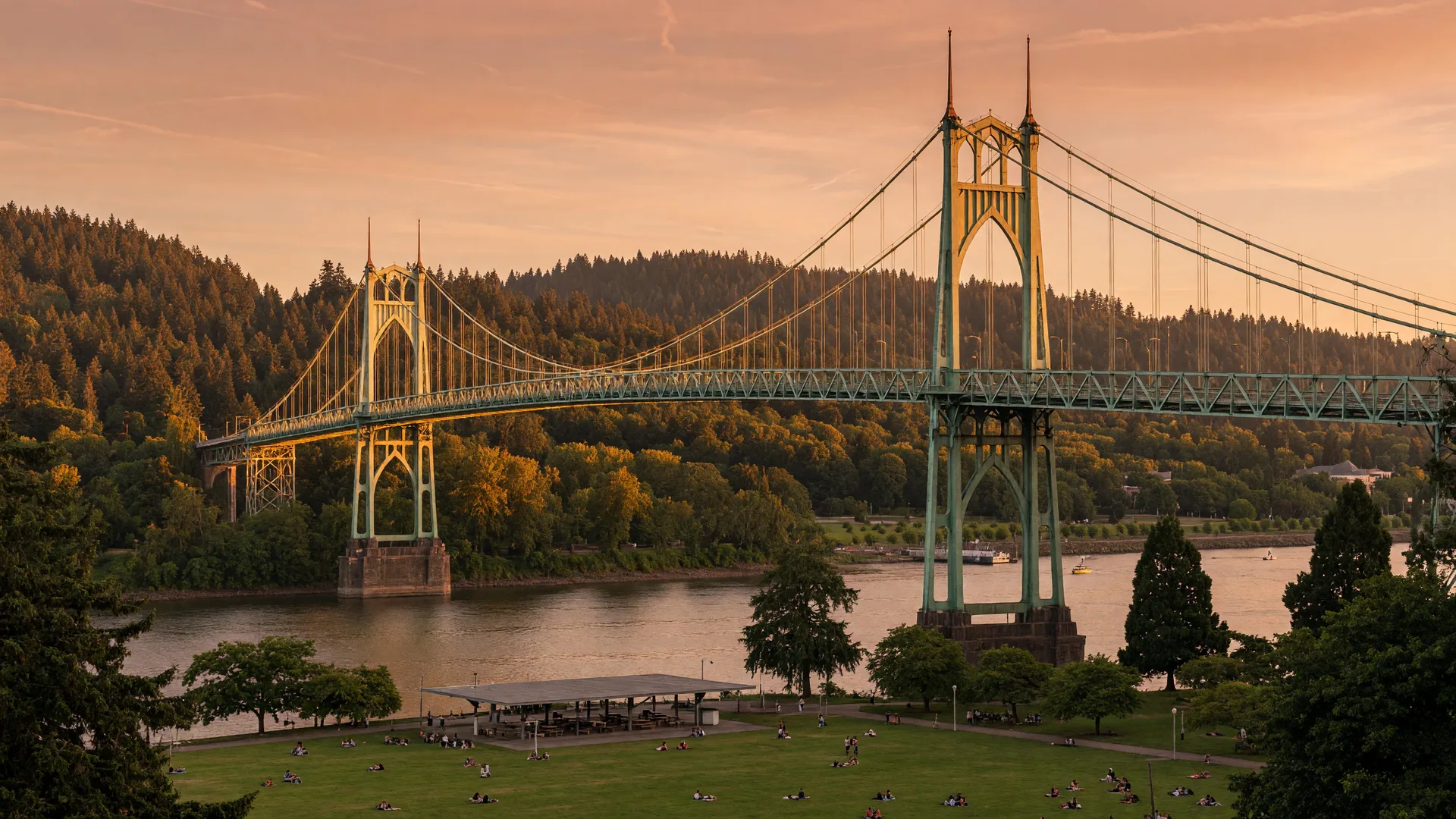 The green gothic towers of the St. Johns Bridge spanning the Willamette River at golden hour