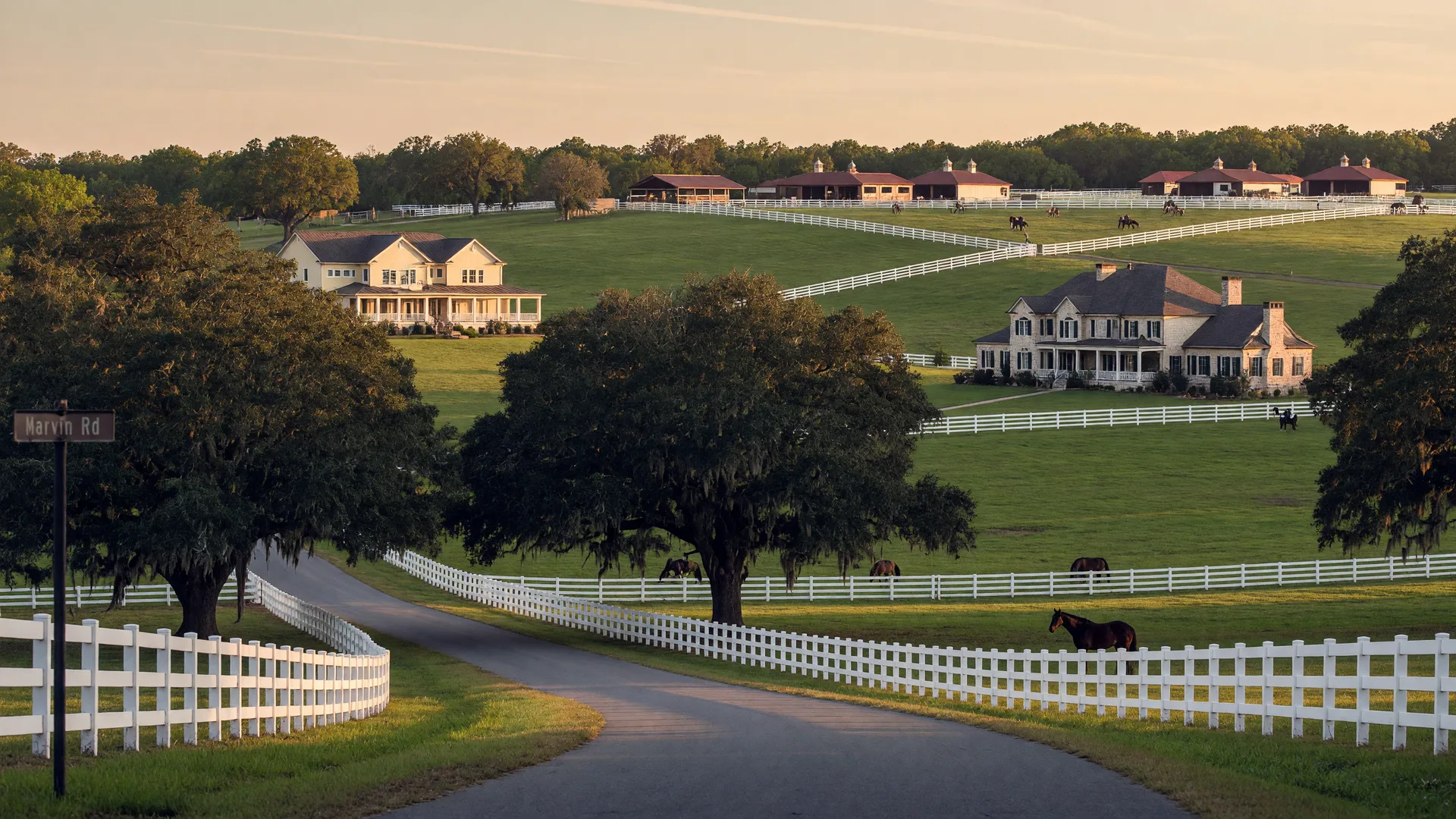 Upscale equestrian community in Marvin NC with white fencing, rolling pastures, and custom estate homes