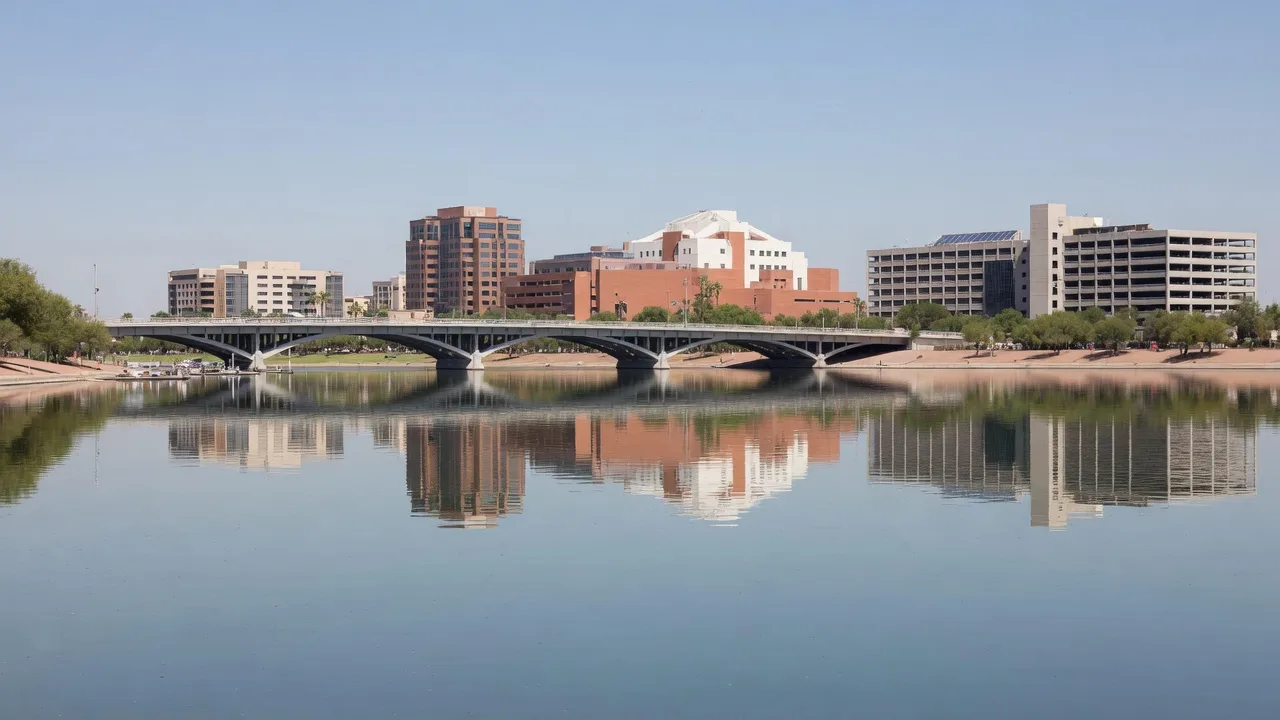 Sailboats and kayaks on Tempe Town Lake at dusk with the downtown Tempe skyline reflecting in the water