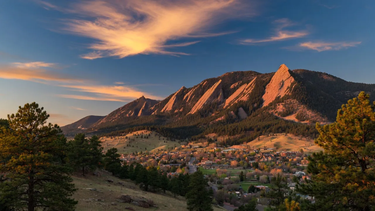 The Flatirons at golden hour over Boulder, Colorado
