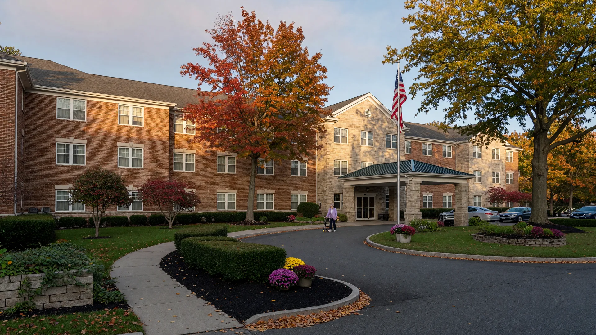 The Daughters of Israel skilled-nursing campus at 1155 Pleasant Valley Way in West Orange NJ, a low brick and stone senior-living building with landscaping and turning autumn trees
