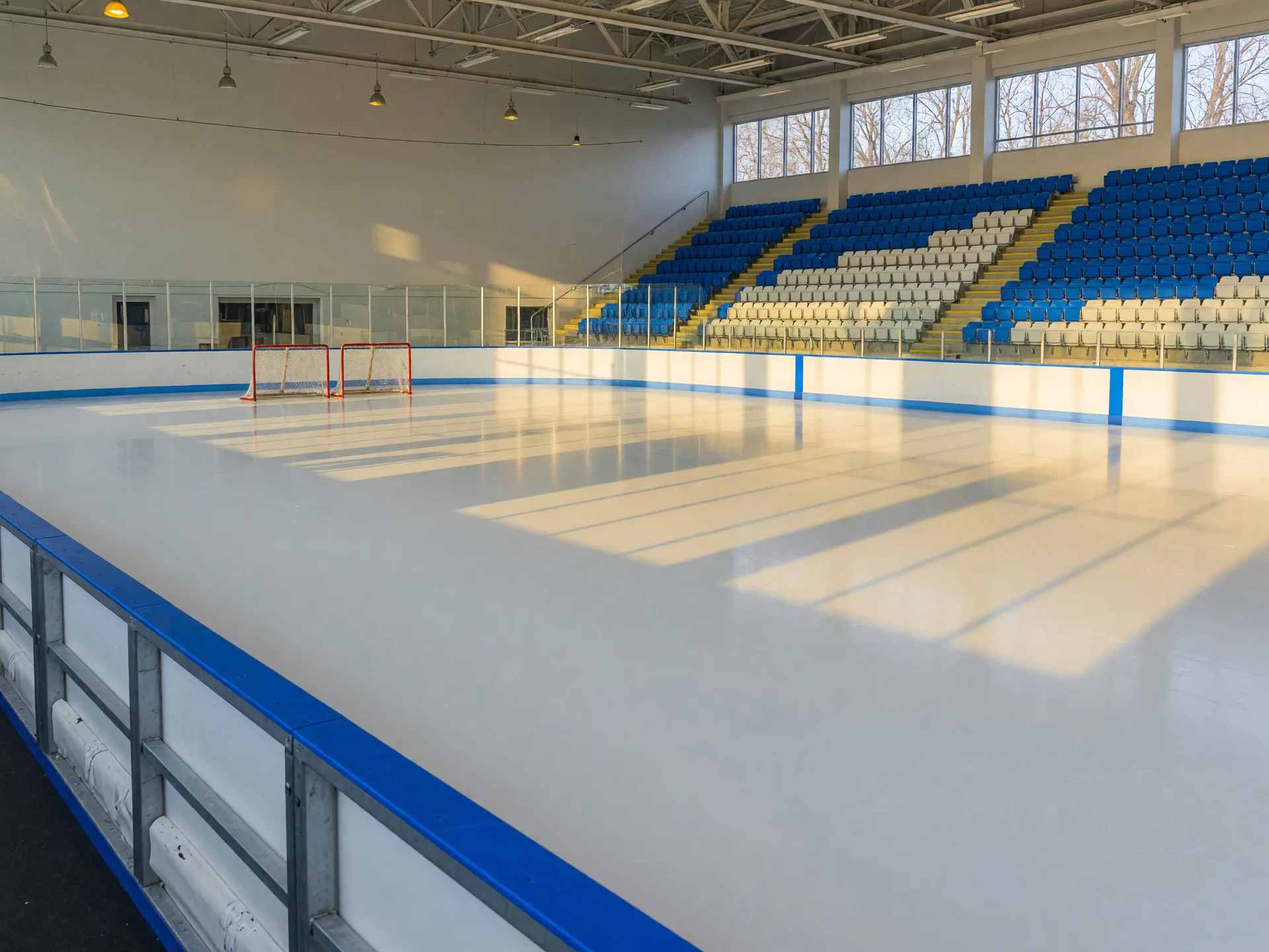 The bright indoor ice sheet and white and blue boards of the C.E. Orr Ice Arena near Memorial Park in Euclid