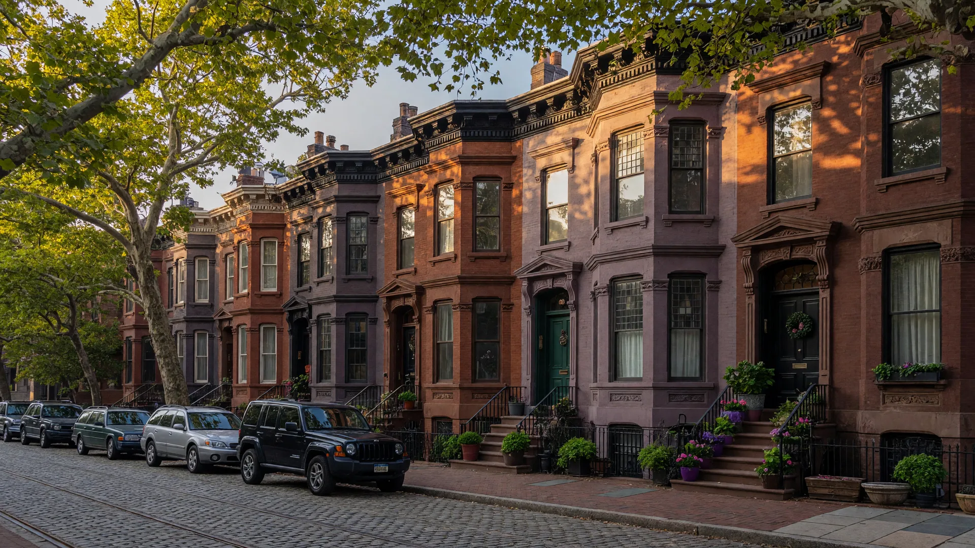 Historic Fitler Square brownstones and townhomes on a tree-lined Philadelphia street in afternoon light