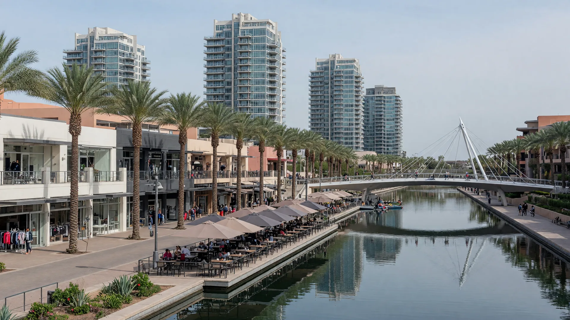 Scottsdale Waterfront canal with glowing restaurant terraces and string lights at dusk