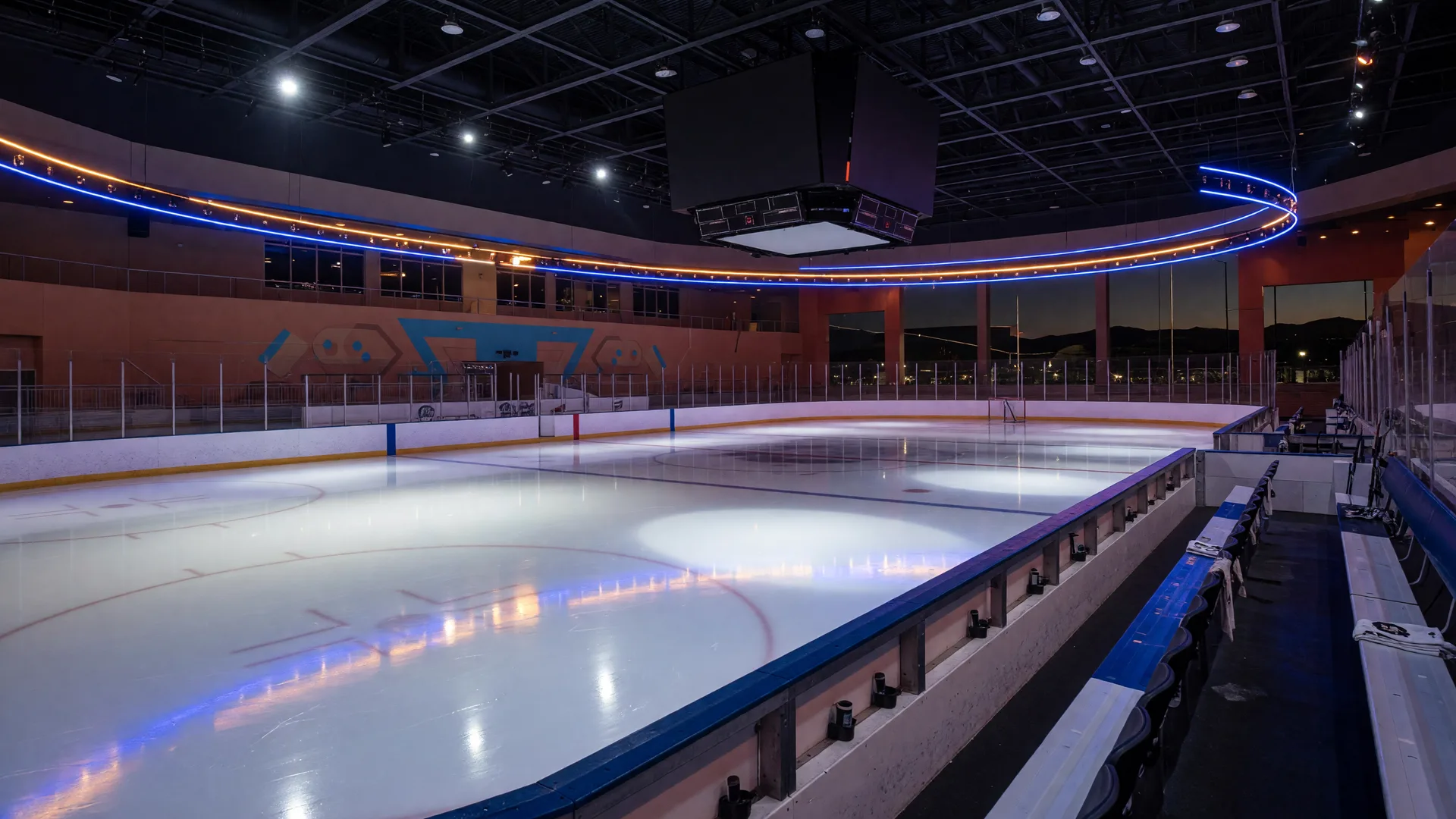 An empty ice hockey arena with freshly resurfaced ice glowing under arena lights ahead of game time