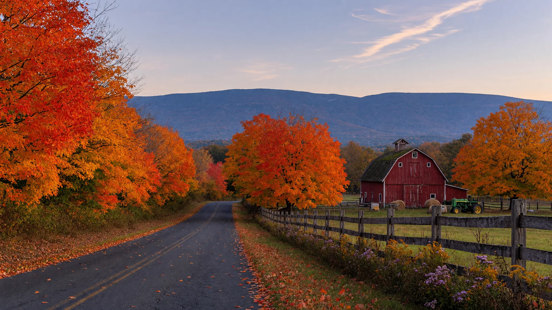 Peak mid-October color on maples lining a quiet Lehigh Valley country lane with a red barn and the Blue Mountain ridge on the horizon