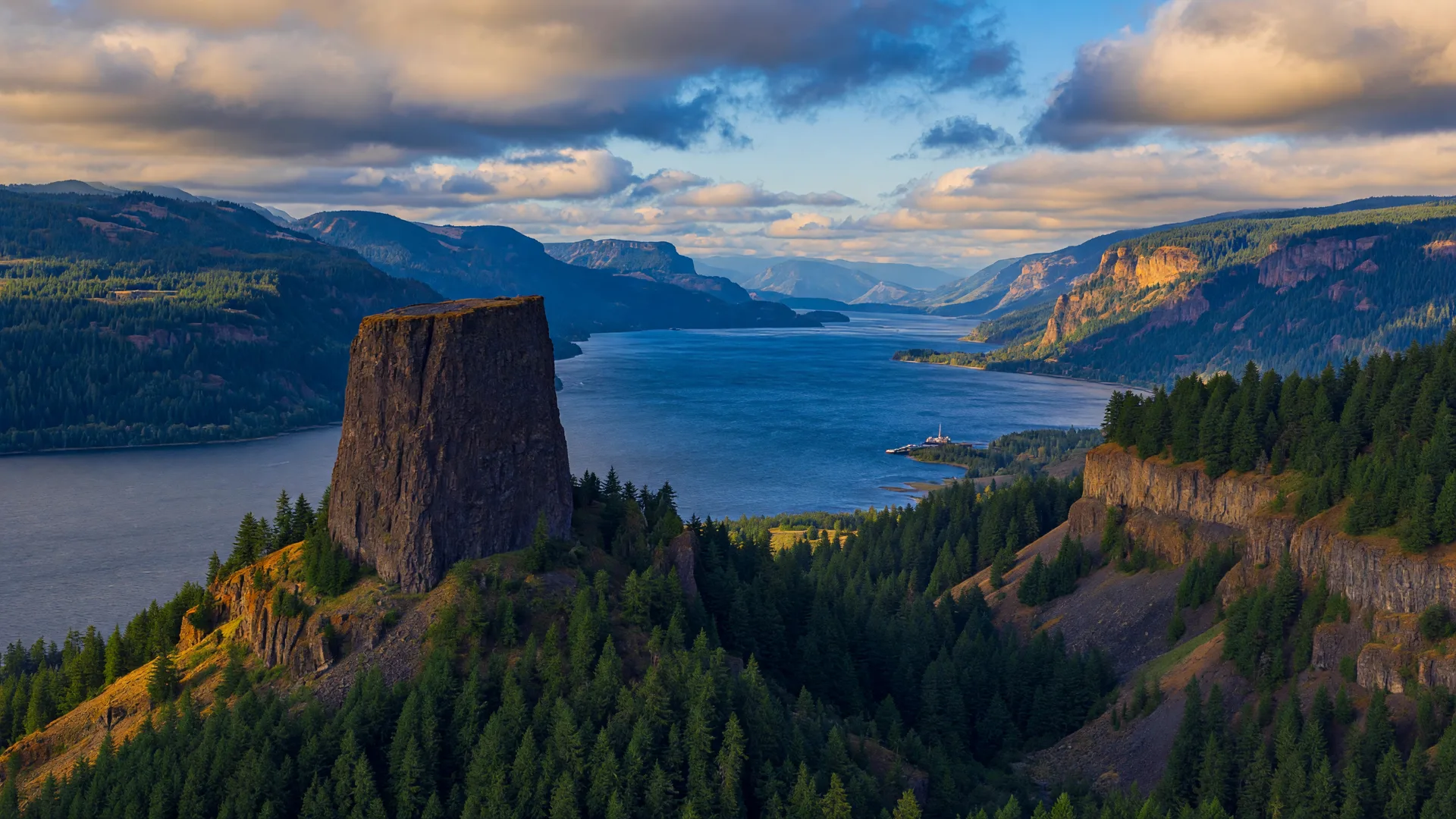 Beacon Rock rising above the Columbia River Gorge with a dramatic sky