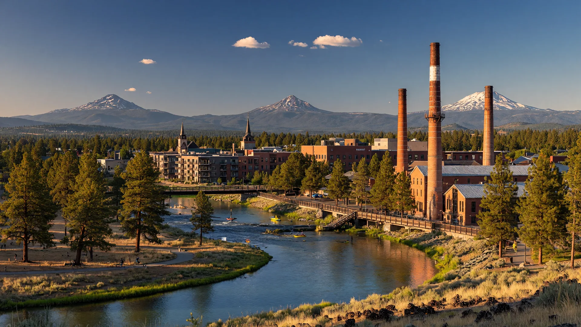 Aerial view of Bend, Oregon with the Deschutes River and Cascade Mountains