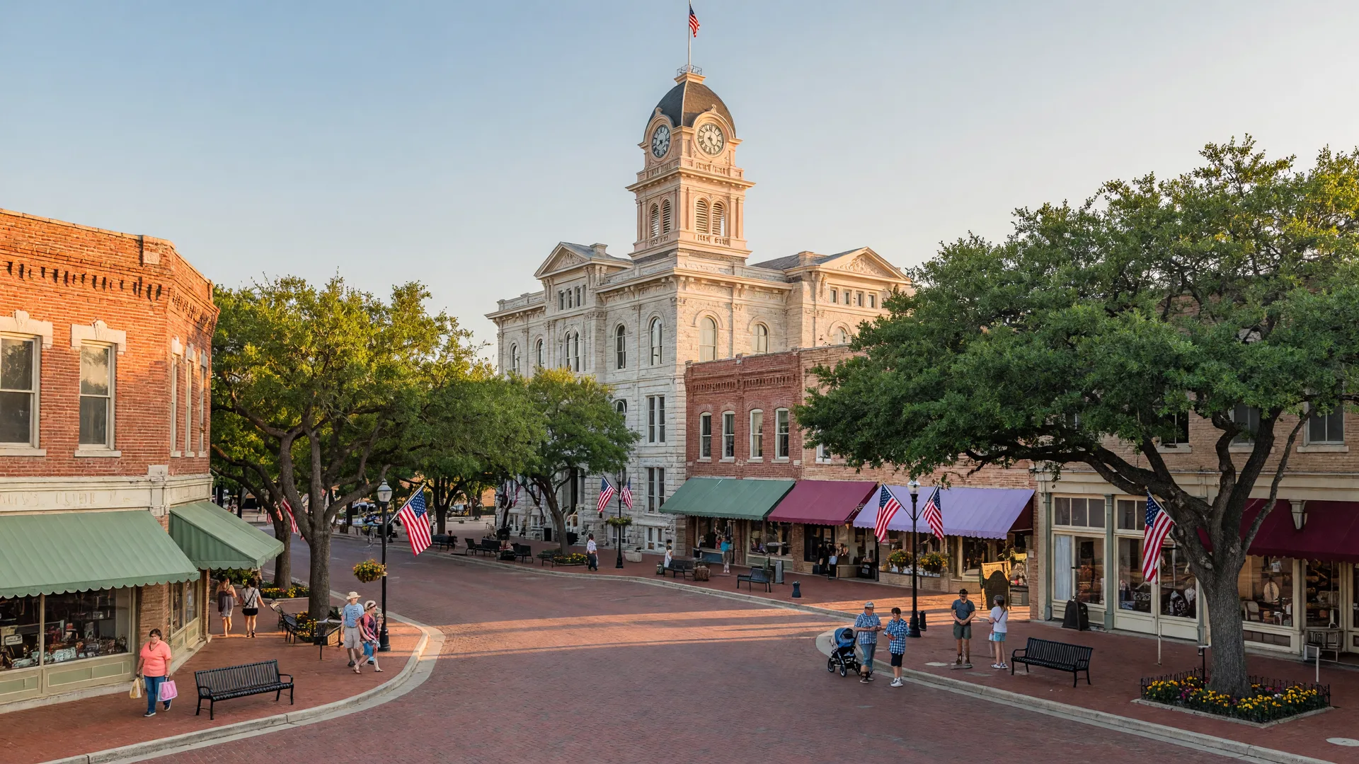 The Williamson County Courthouse clock tower above the red brick streets of Georgetown's historic square