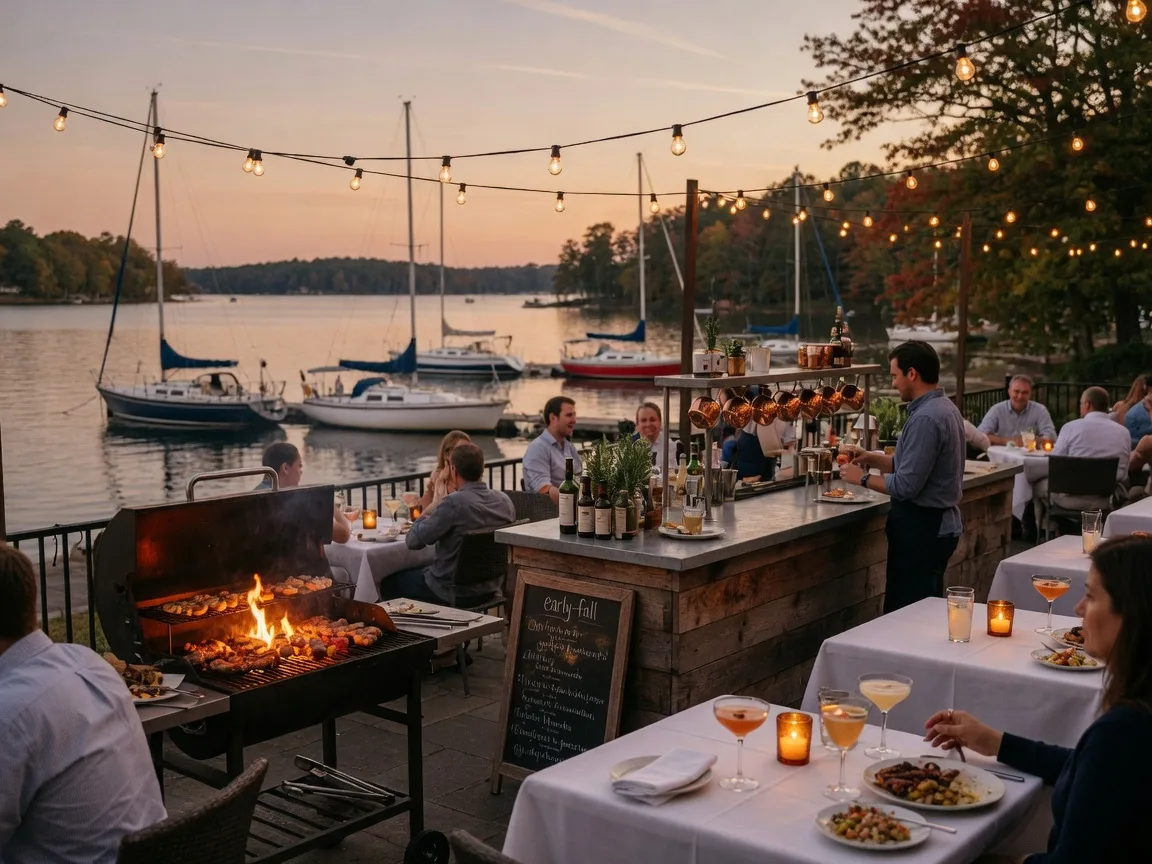 A warm evening on an upscale lakeside restaurant patio in Cornelius with a glowing grill, craft-cocktail bar, candle-lit tables, sailboat harbor views, and early-fall string lights overhead