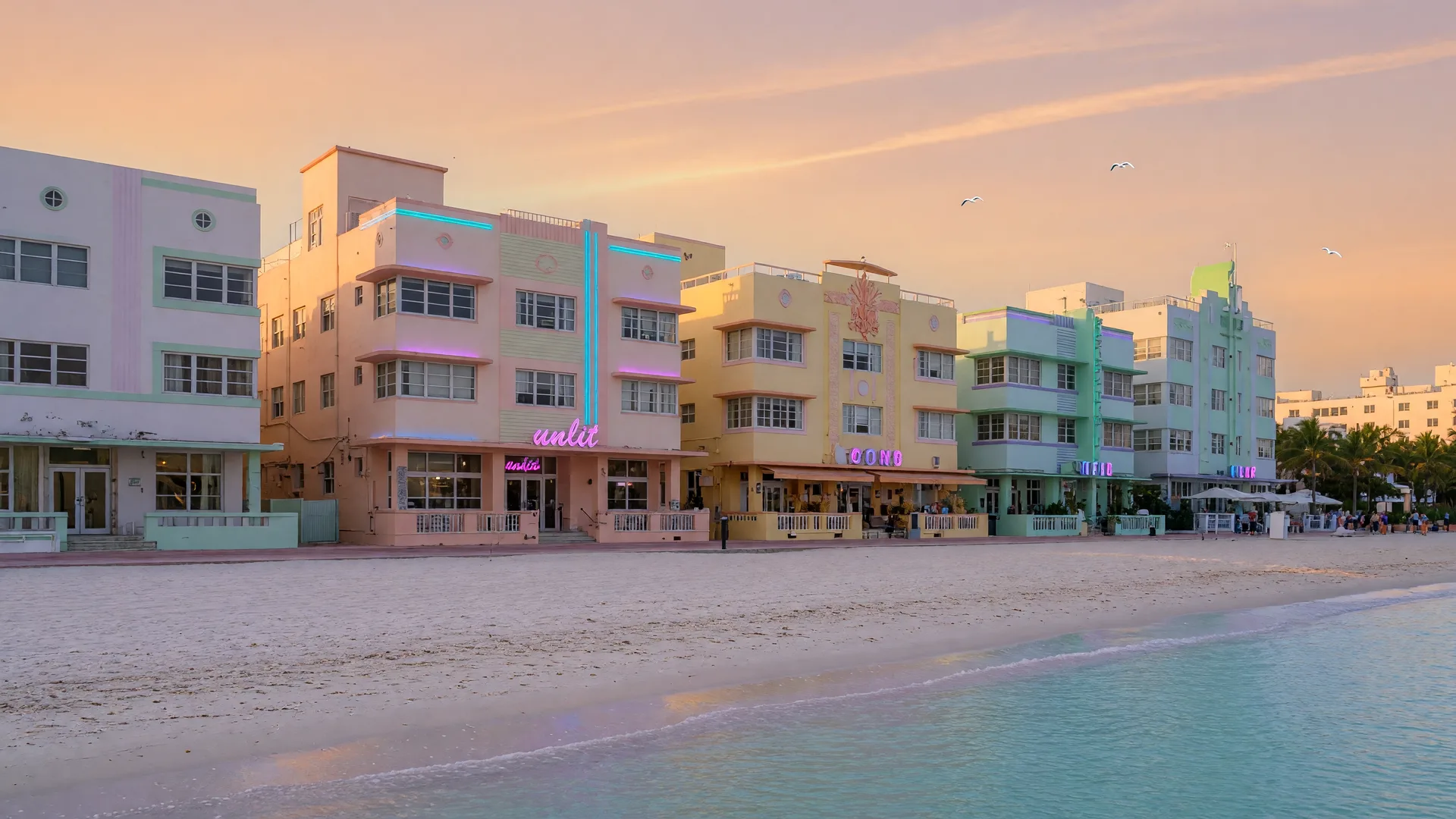 South Beach pastel hotels and sand at golden hour, with calm turquoise water