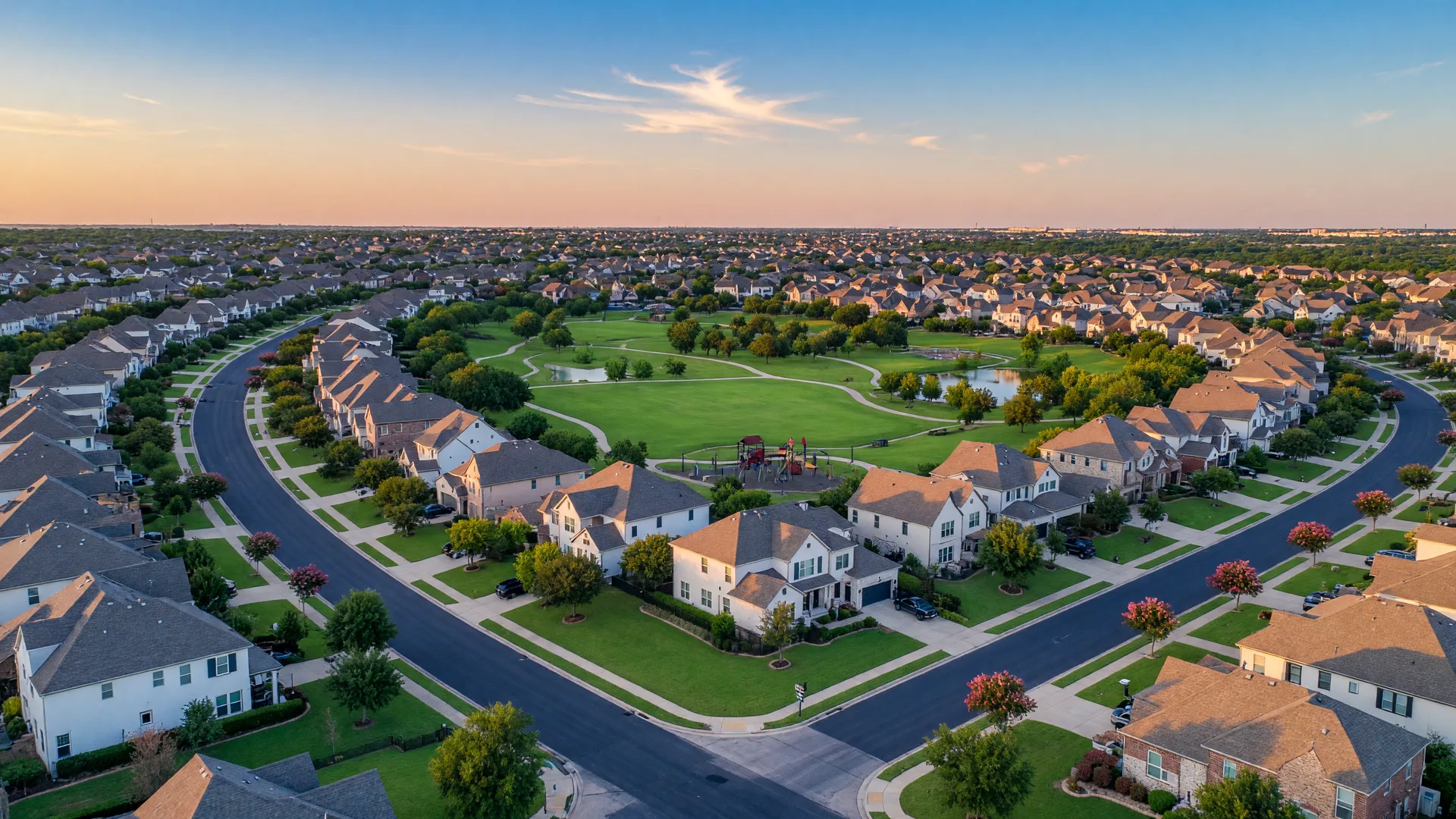 Aerial view of a North DFW residential community with tree-lined streets and modern homes