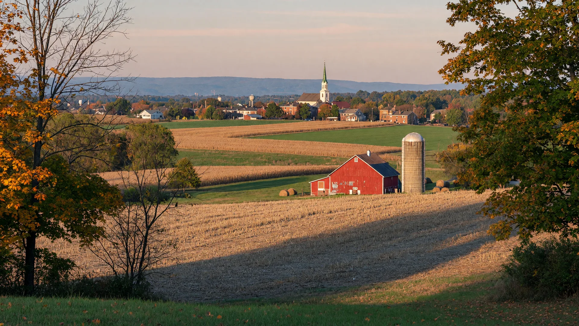 Rolling farmland and a small town near the Blue Mountain ridge in early autumn