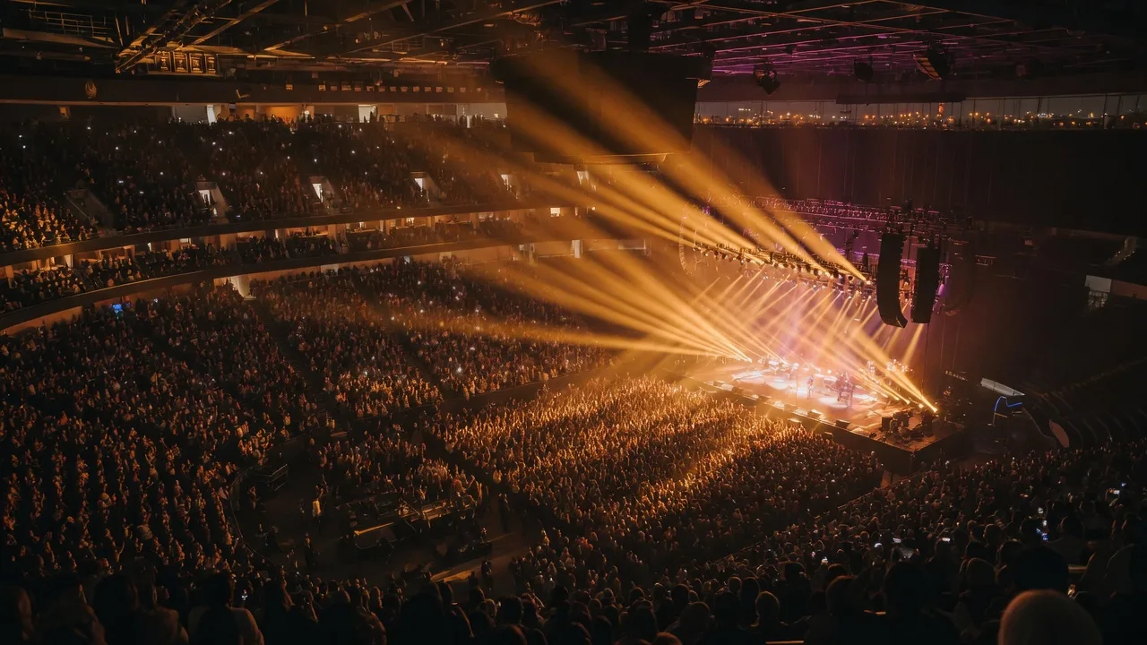 The BOK Center arena glowing with warm stage lights on a fall concert night
