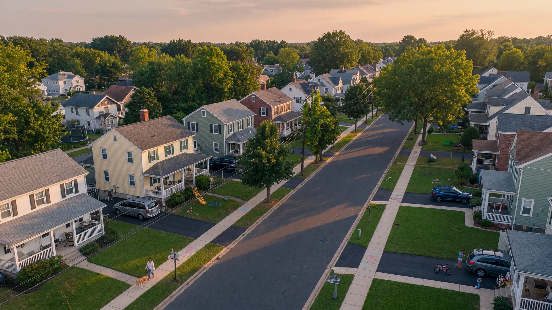 Aerial view of a residential neighborhood in Clifton, New Jersey with tree-lined streets and classic homes