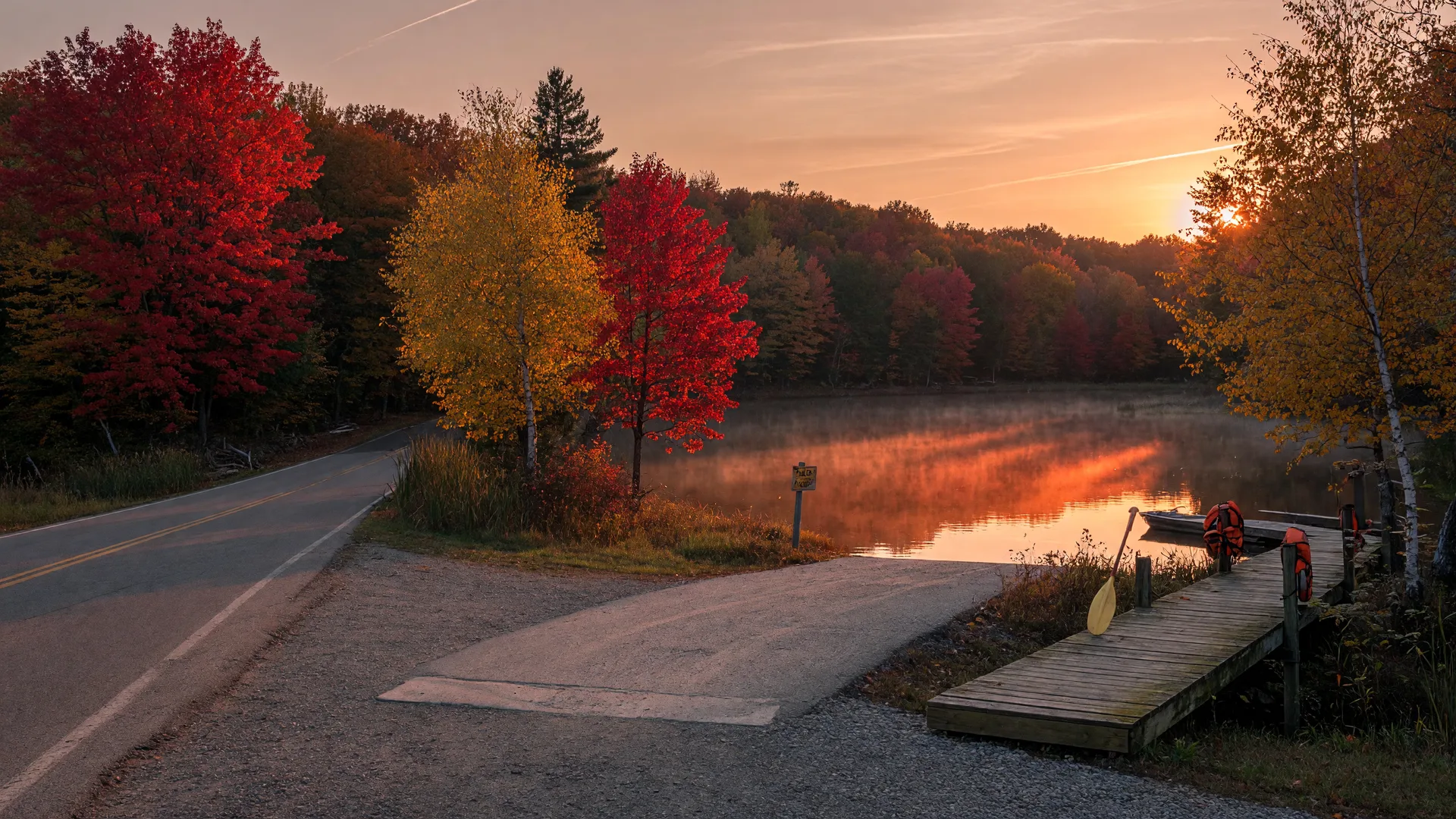 Peak autumn color on a small Northwoods lake near Spooner, Wisconsin at golden hour