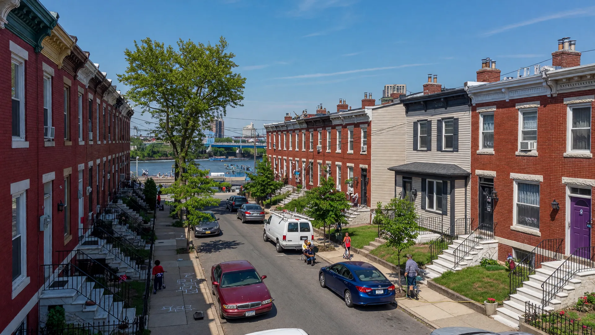 Classic brick rowhomes with marble steps on a residential street in Grays Ferry, Philadelphia