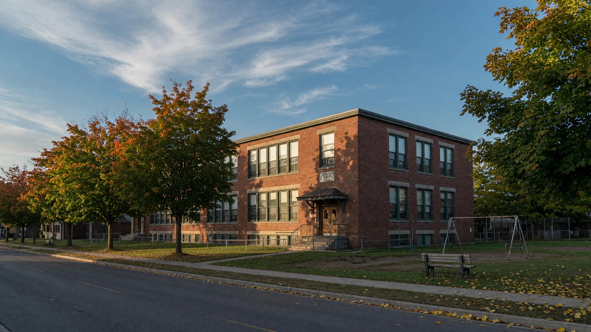 Heritage red-brick public school in Campbellford on a September morning with early fall colour
