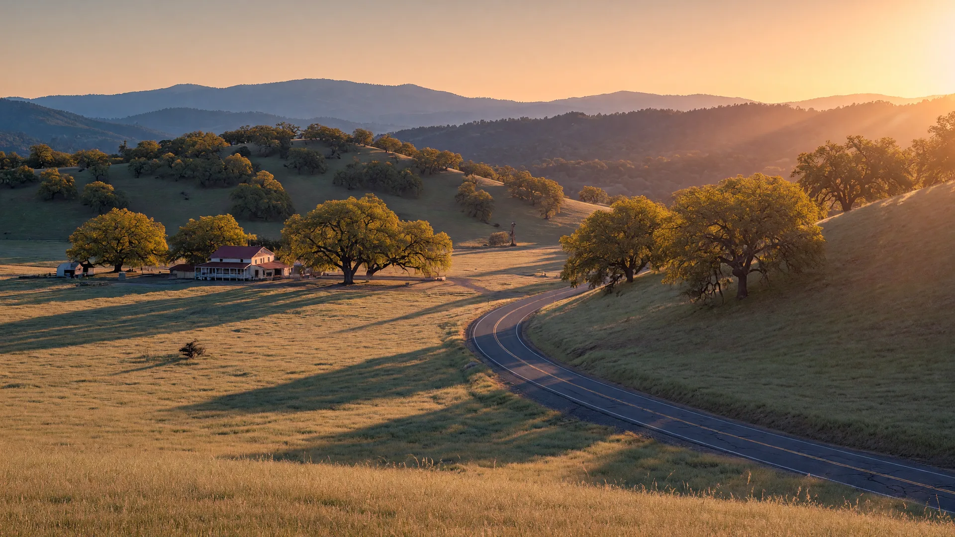Rolling oak-covered hills of California Gold Country at golden hour