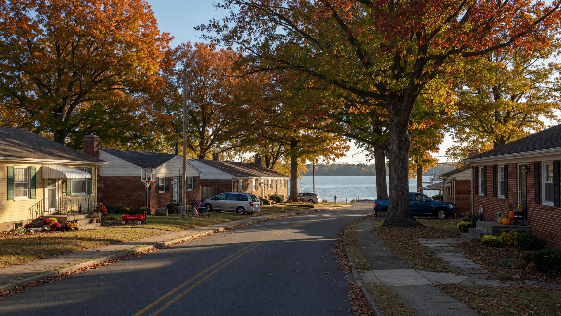 Family-friendly residential street in Newport News Virginia with mid-century homes and mature oak trees