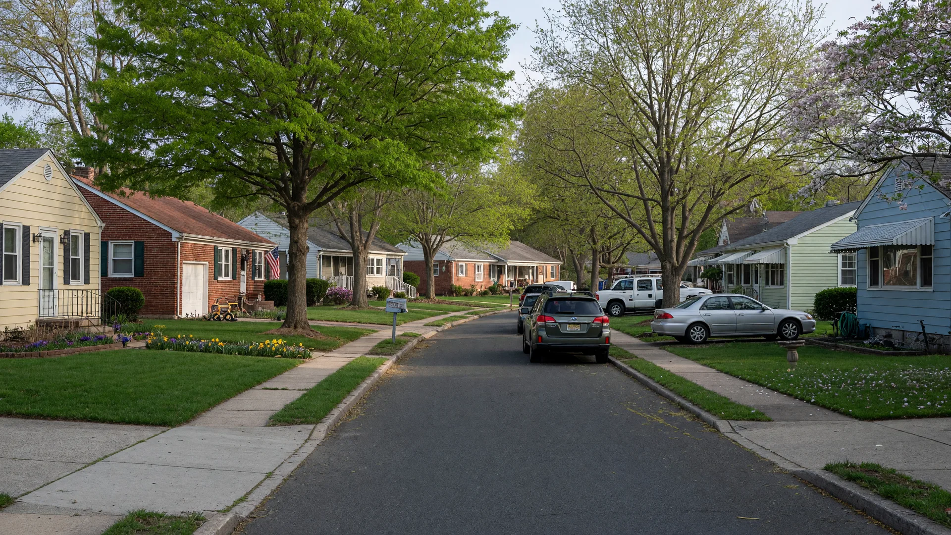 Quiet residential street in Mount Ephraim, New Jersey with classic homes and mature trees
