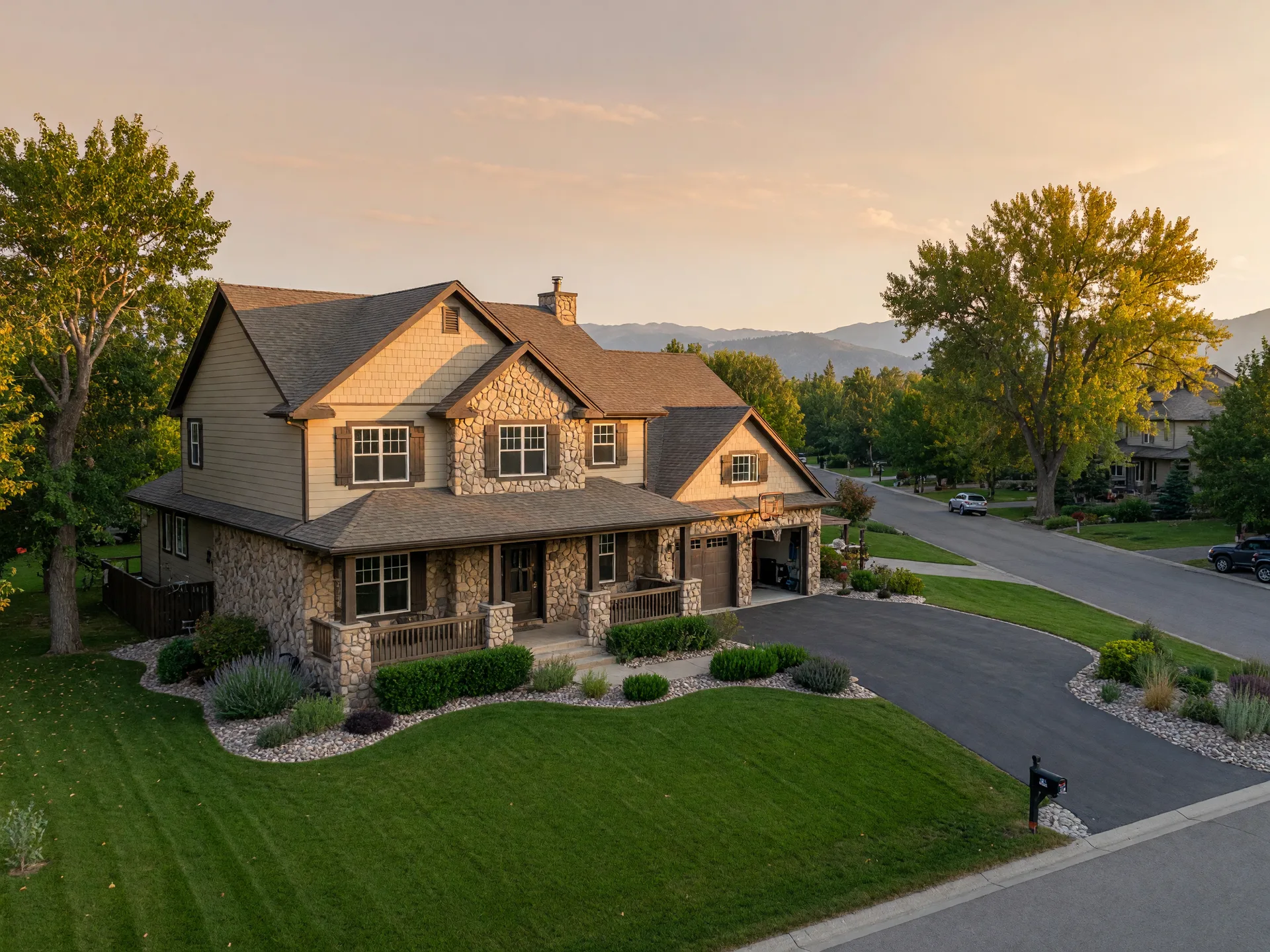 A substantial two-story family home on a generous Treasure Valley lot at golden hour