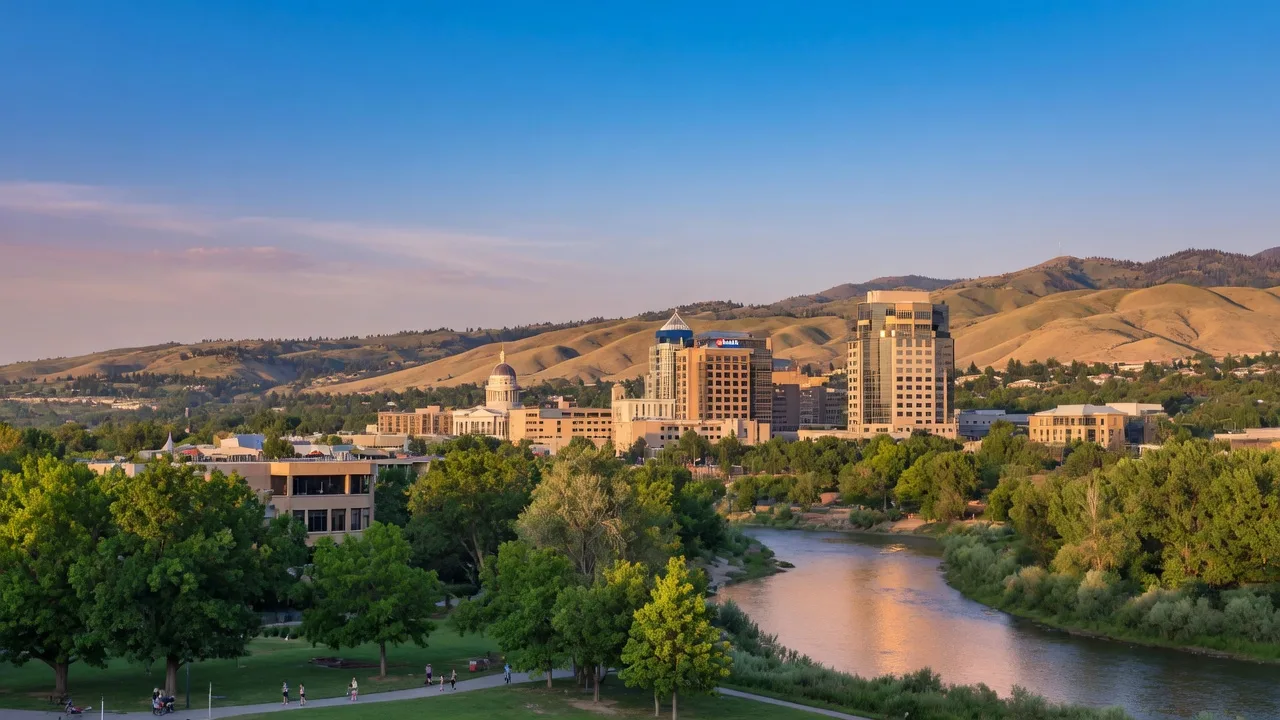 The Boise Idaho skyline at golden hour with foothills and the Boise River Greenbelt