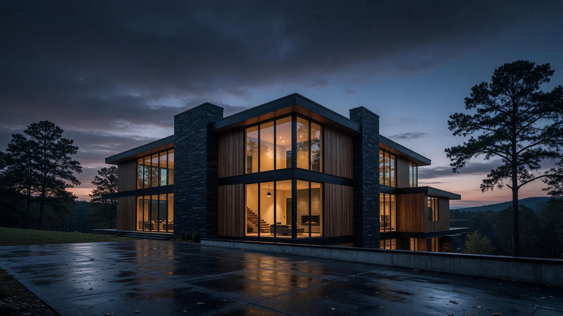 A modern luxury home at dusk, warm light glowing through floor-to-ceiling windows against a deep twilight sky