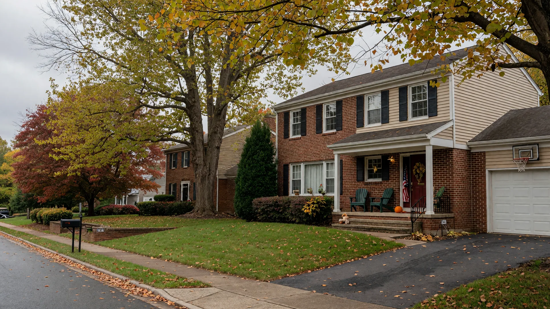 A well-kept colonial home on a leafy Maryland street, quiet and waiting after the owner has passed