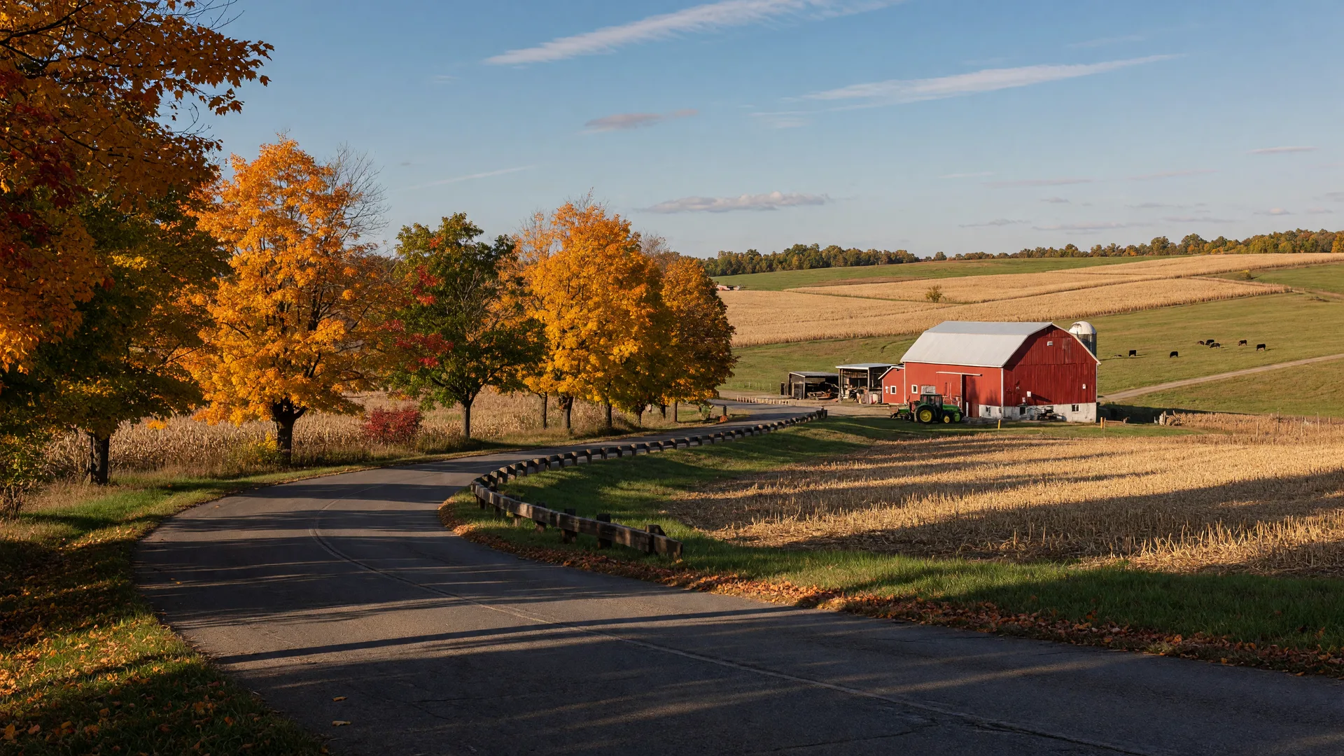 A country road winding through early autumn foliage in Indiana County, PA