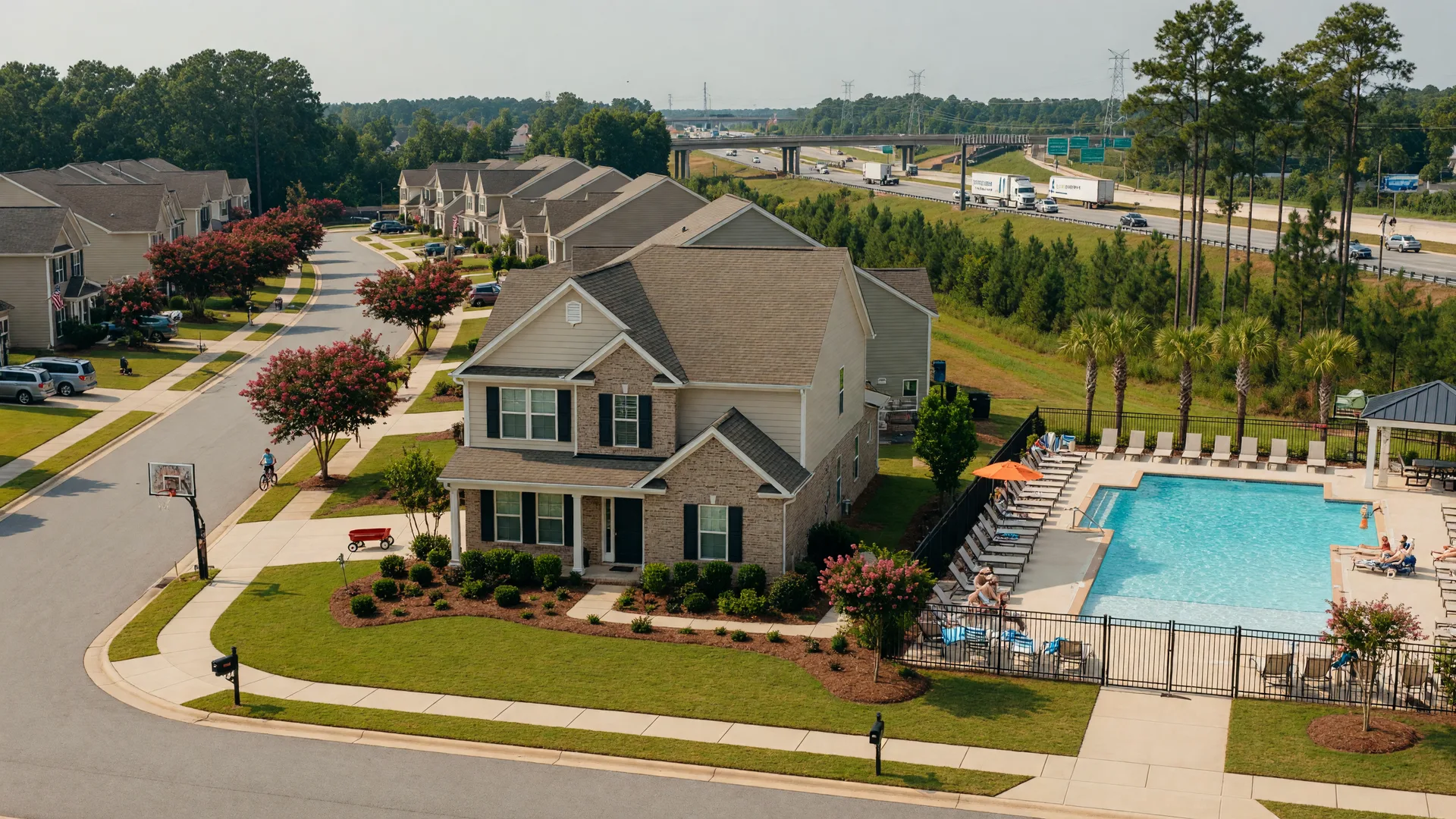 A brick-front single-family home and landscaped street in the Regent Park community of Fort Mill, South Carolina