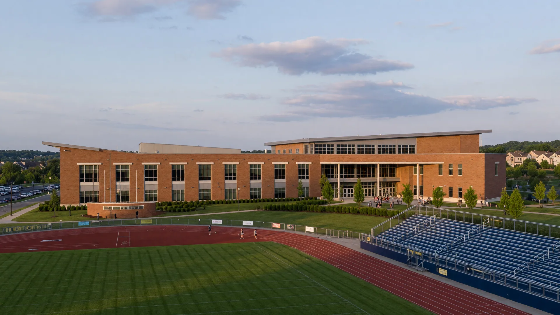 Modern Central Bucks school campus with green athletic field in Buckingham Township
