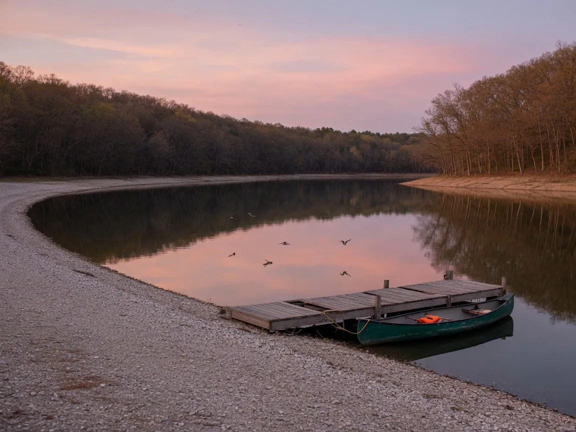 A calm, wooded reservoir at dusk with a wooden dock and canoe, reflecting the pastel sky, near the Route 3 West corridor in the Fredericksburg, Virginia area