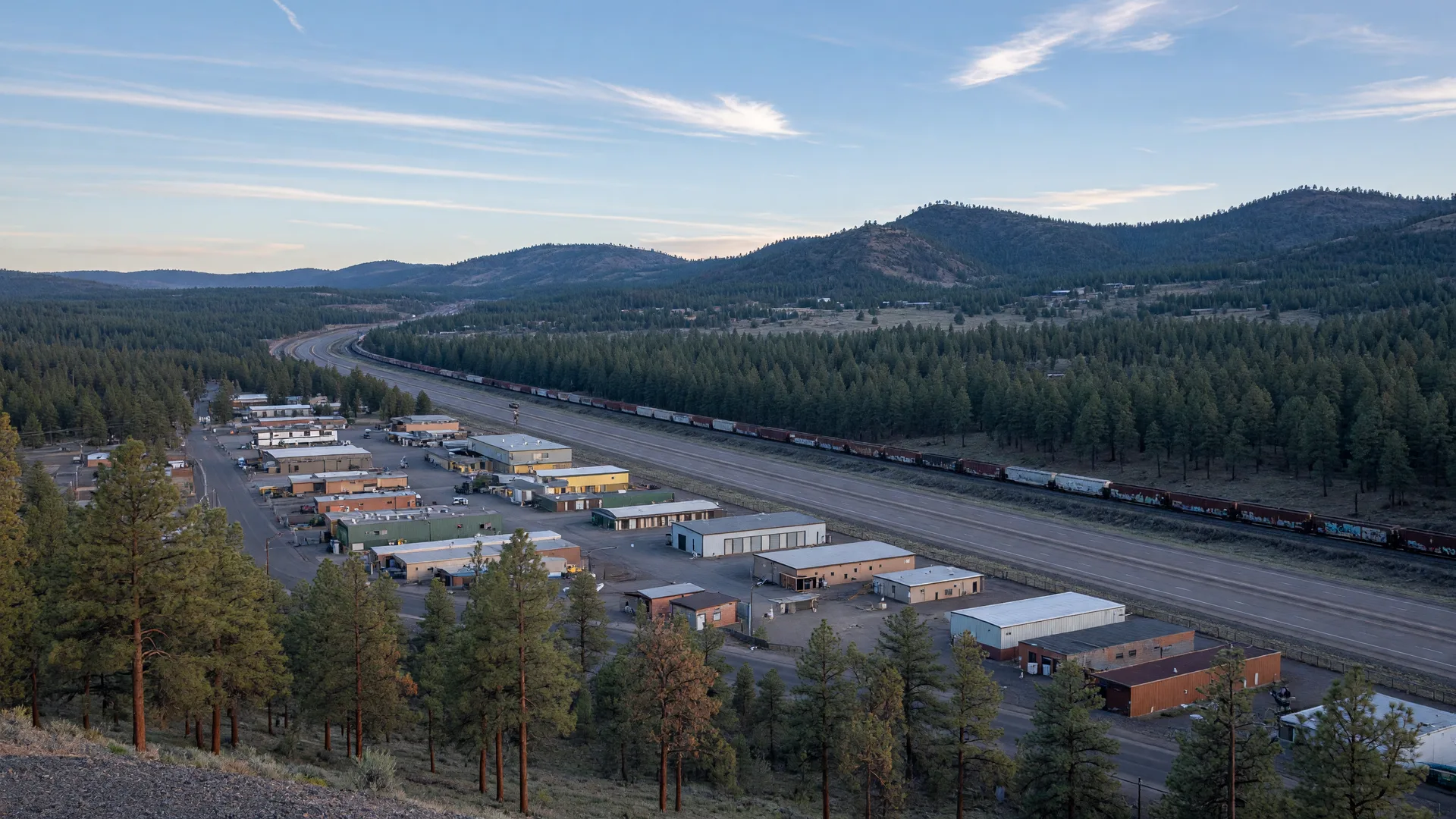 Commercial and industrial land sites among ponderosa pine forest along a Northern Arizona interstate corridor