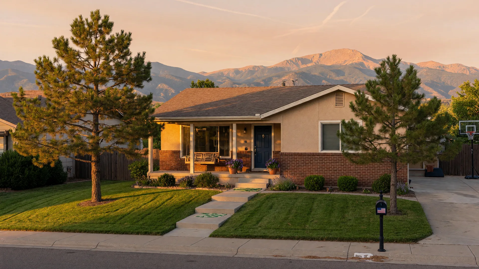A well-kept Colorado Springs home at golden hour, ready to sell while its owners are away