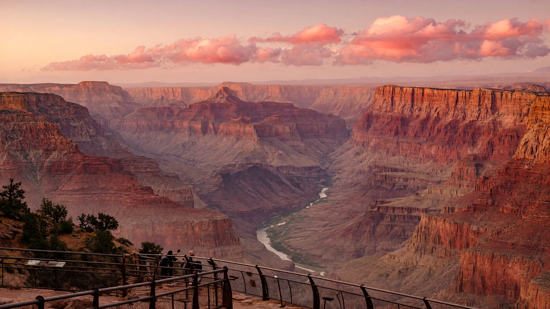 Sunrise over Grand Canyon National Park's South Rim with layered canyon walls descending to the Colorado River
