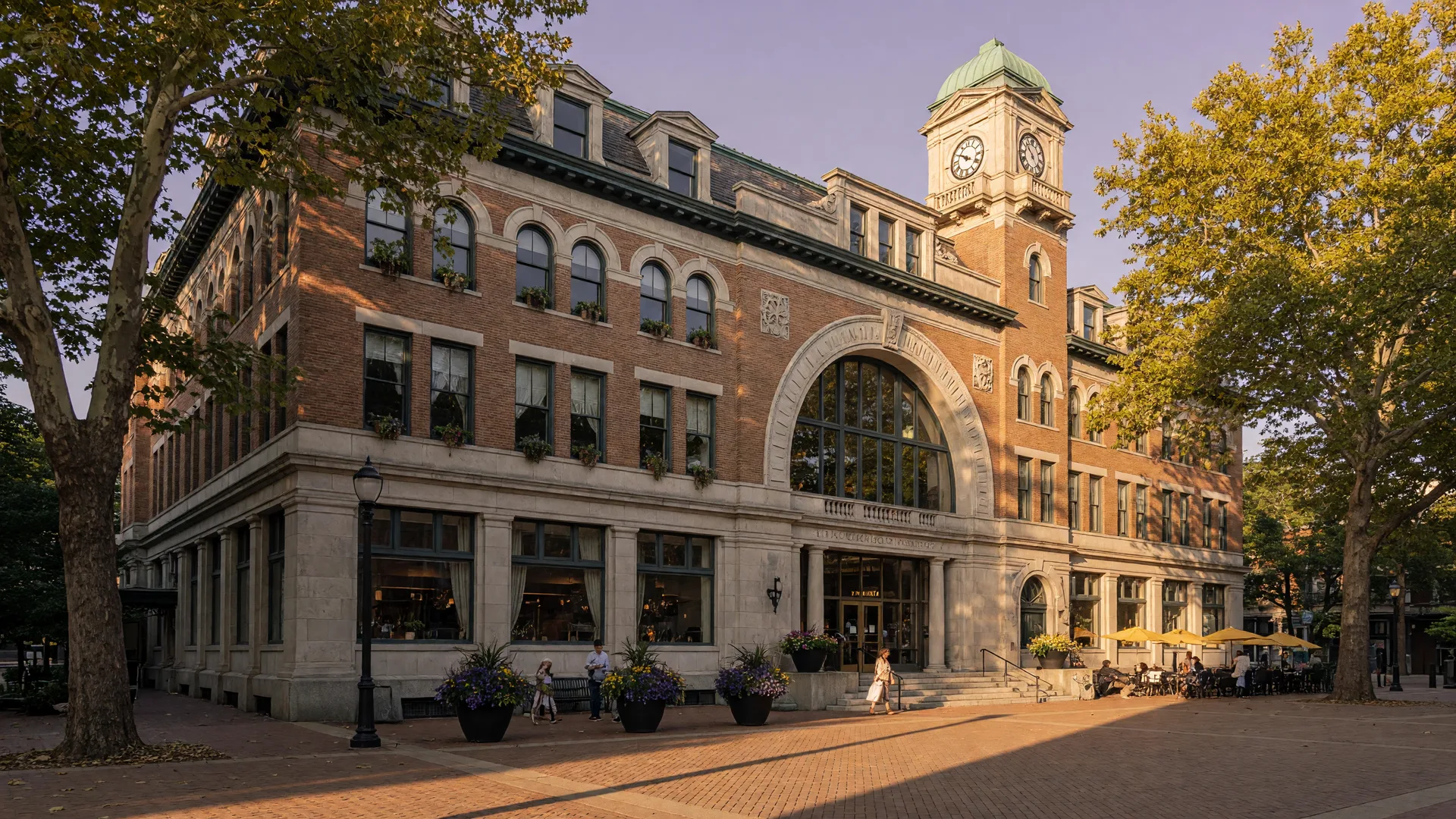 Historic 1913 Lackawanna Station terminal building in downtown Montclair NJ with brick and stone architecture,in warm late-summer light