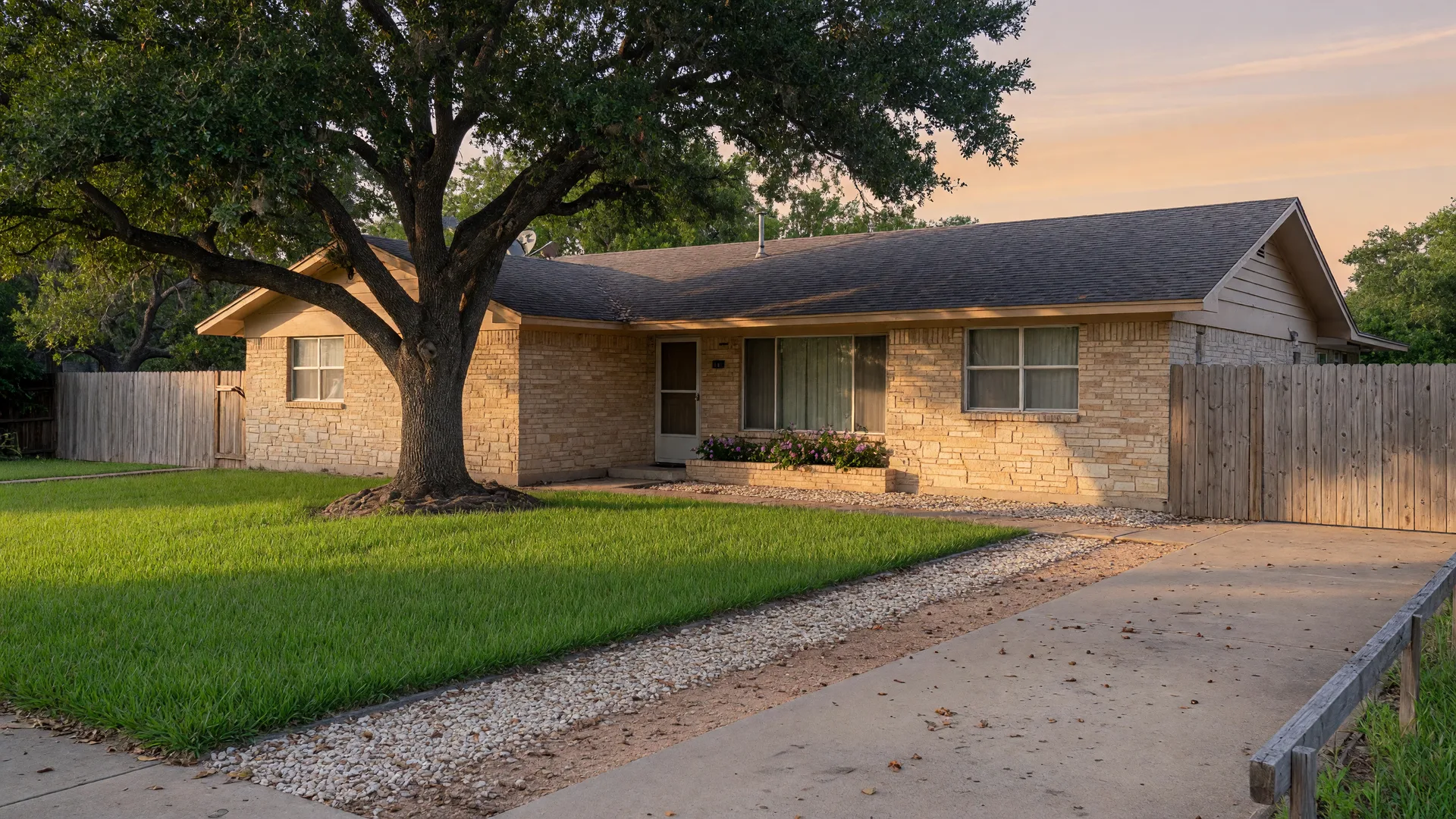 A San Antonio ranch-style home at sunrise with well-drained soil sloping away from the foundation