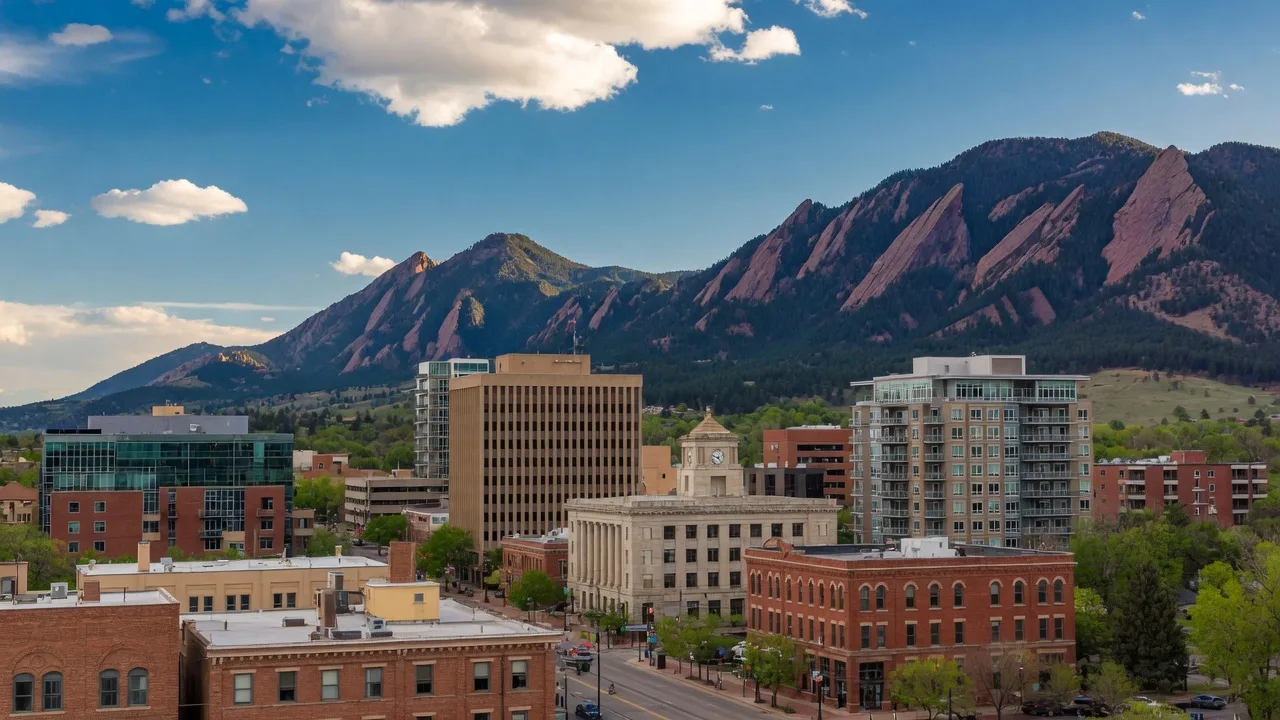 Downtown Boulder skyline with Flatirons mountains in background