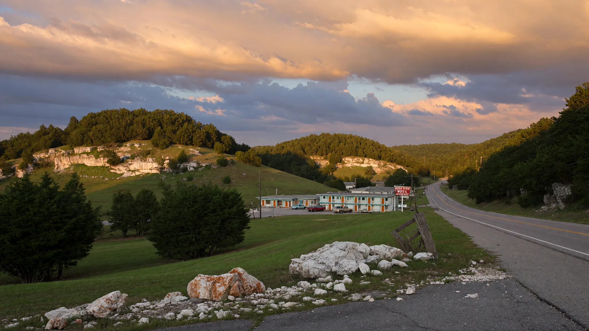 Rolling limestone hills and cave country near Cave City with oak and cedar trees in golden light